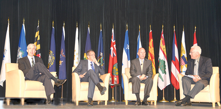 From left: Matthew Slaughter of Dartmouth College, Gov. Dannel Malloy of Connecticut, Gov. Jack Markell of Delaware, and moderator Ralph J. Begleiter.
