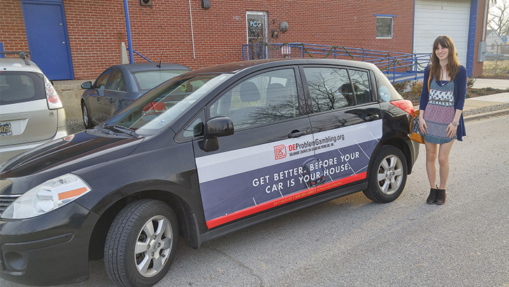 Mikayla Paul drives a car that advertises help is available through the Delaware Council on Gambling Problems. (Photo courtesy of Carvertise)