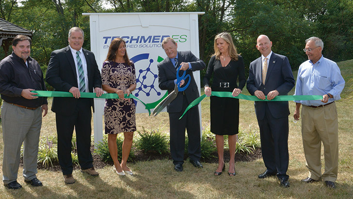 Pictured are TES Engineering Manager Mark Monaco, Managing Director Tom Drye, Delaware Economic Development Office Director Bernice Whaley, CEO John Manuck, Mary Manuck, Gov. Jack Markell, and Director of Manufacturing Farokh Kheradi.